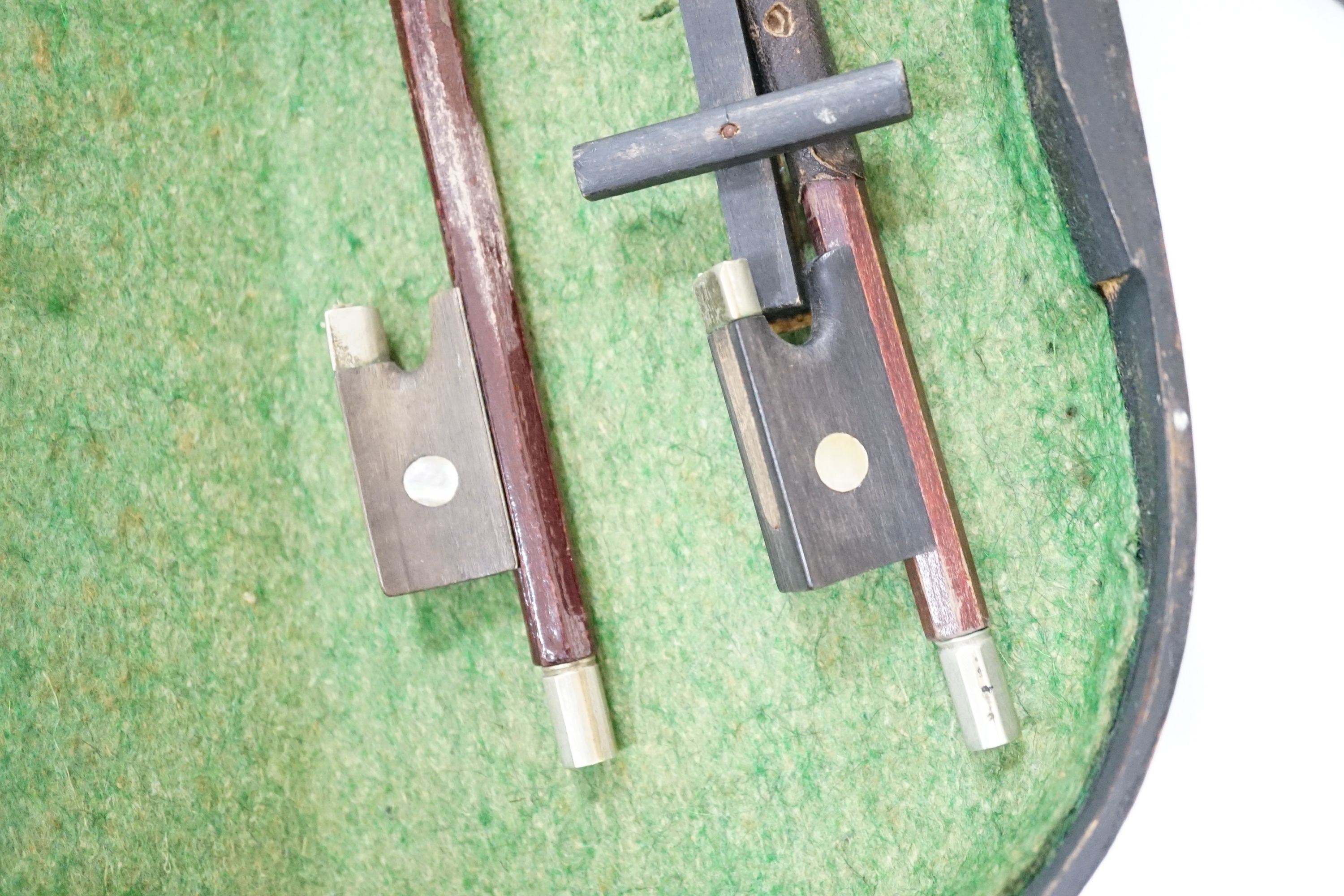 A 19th century 3/4 size violin, cased with 2 bows and 1 other German violin